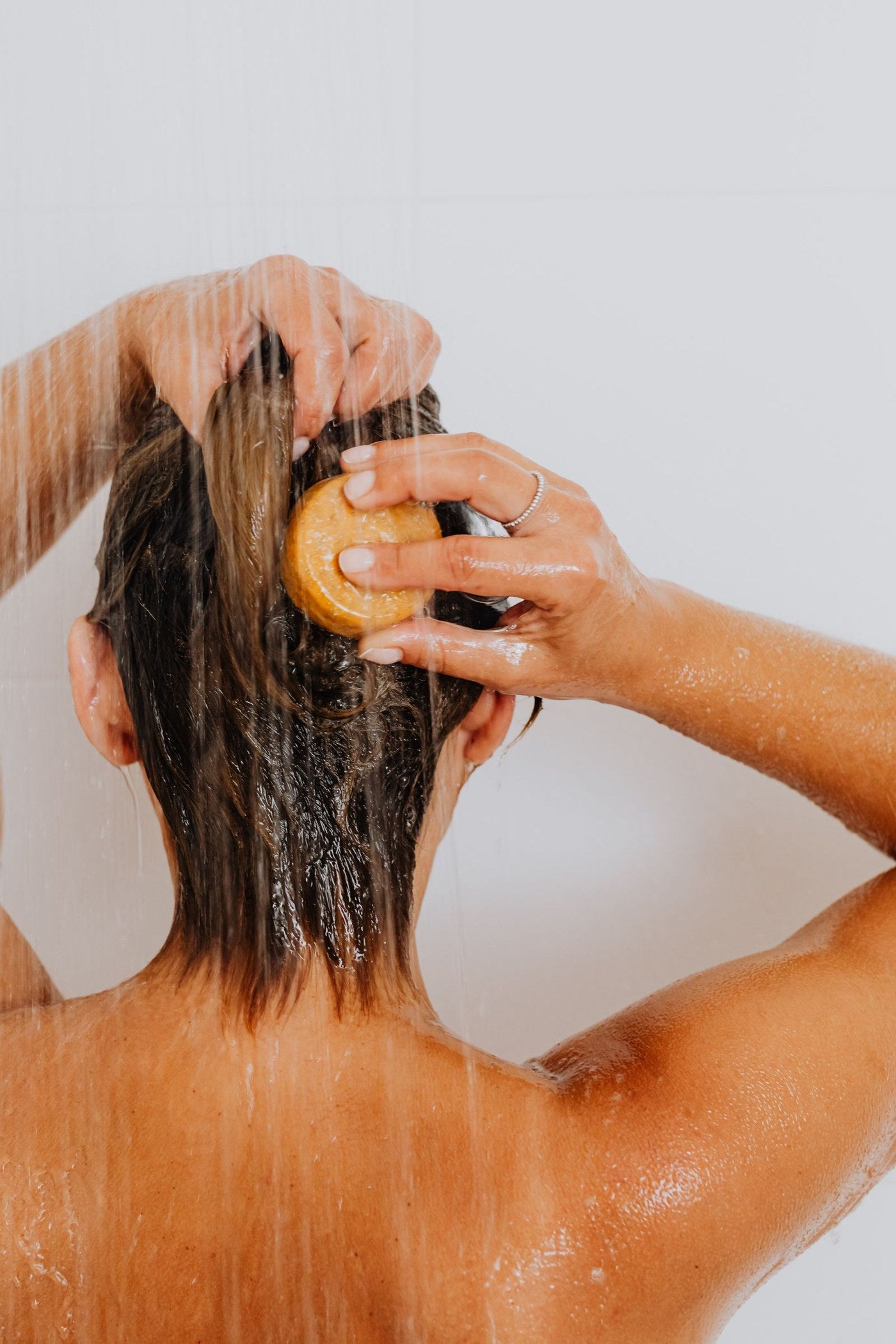 Residue, impurities, visible flakes, or loosened buildup can leave scalp and hair feeling less clean.